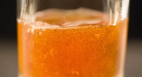 Beer pouring in glass closeup macro shot video Stock Footage 103636489