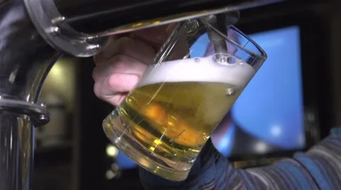 Beer Pouring into Glass from restaurant bar tap Stock Footage 59642850