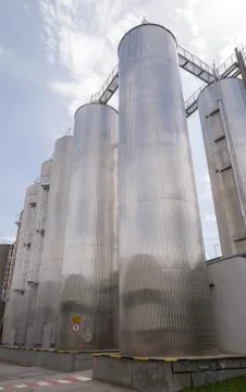 Beer processing and storage silos in beer factory Stock Photos