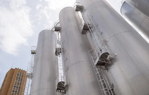 Beer processing and storage silos in beer factory Stock Photos