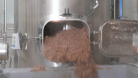 Beer Production. Brewer Pulls Out Spent Malt From A Beer Brewing Tank. Stock Footage 191142002