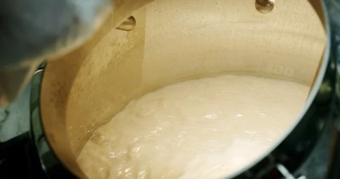 Beer production microbrewery, Barley malt grain pouring to vats tank for beer Stock Footage 129524853