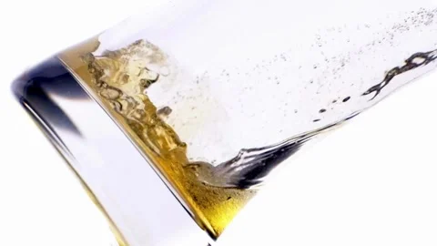 Beer pub Pint Bottle of beer into Glass pouring into glass and creating foam Stock Footage 265837814