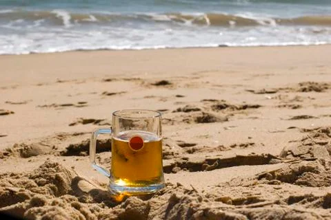 Beer on sandy beach Stock Photos