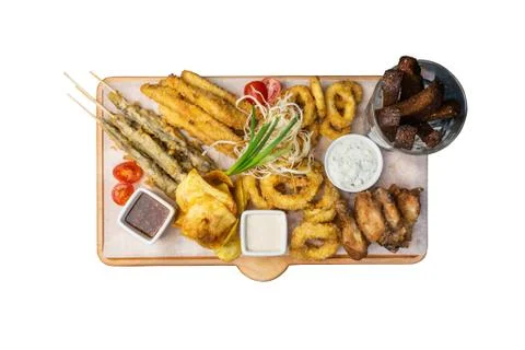 Beer snacks set. Fish set served on cutting board with the mugs, isolated on the Foto stock