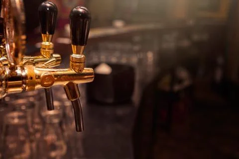 Beer tap in the bar Stock Photos