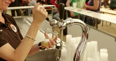 Beer tapping in plastic glasses, 4K Stock Footage 51457677