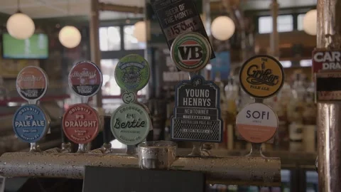 Beer Taps and Bar Interior with Patrons at Sydney Pub, Australia, March 2014 Stock Footage 345663620