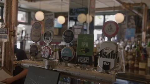 Beer Taps and Drink Selection at Busy Bar Counter in Sydney, Australia Stock Footage 345663612