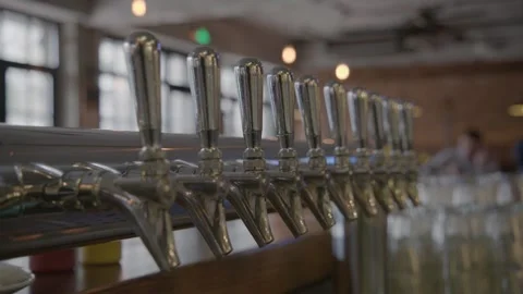 Beer Taps and Glasses on Bar Counter in Beijing Pub Interior, China Stock Footage 345757324