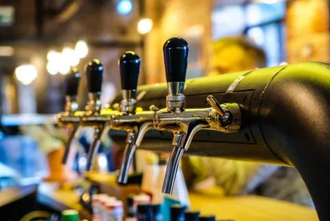 Beer taps at the bar in a row, selective focus Foto stock