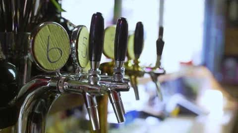 Beer taps in the bar in slow motion Stock Footage 220622957
