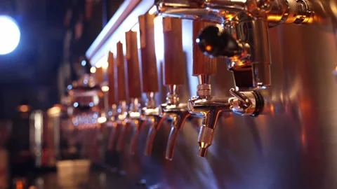 The beer taps in a pub. nobody. Selective focus. Alcohol concept. Vintage style Stock Footage 203765950