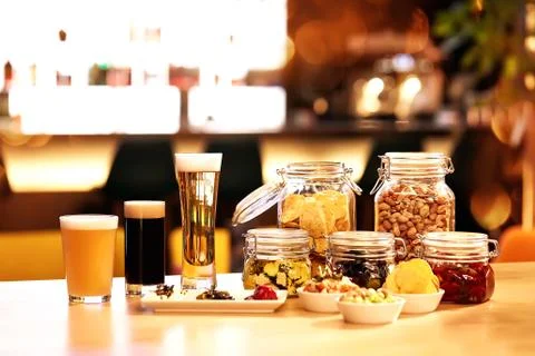 Beer tasty yellow glass drink table food, background Stock Photos