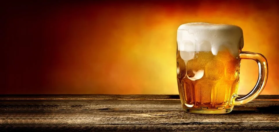 Beer on timber table Stock Photos