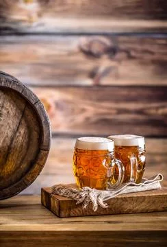 Beer. Two cold beers. Draft beer. Draft ale. Golden beer. Golden ale. Two g.. Stock Photos