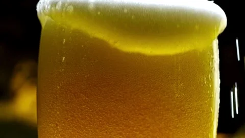 Beer Wave Curve Shape Inside a Glass In Slow Motion Macro Shot on Phantom C.. Stock Footage 265767366