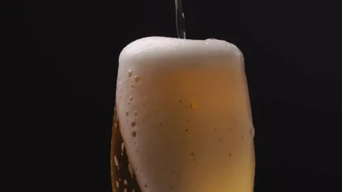 Beer Wave overflow Shape Inside a Glass In Slow Motion Macro Shot on Phanto.. Stock Footage 265767749