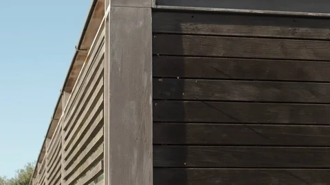 Bees flying in slow motion, entering wooden building through planks Stock Footage 116791076