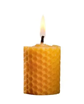 Beeswax candle burning with a flame Stock Photos