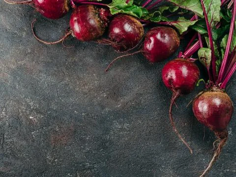 Beet, beetroot bunch on dark background, copy space Stock Photos