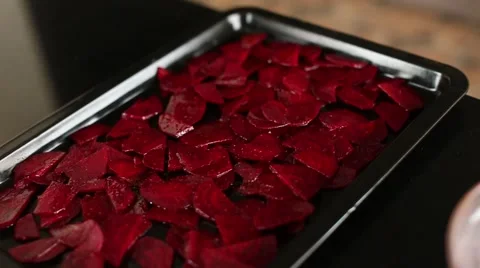 Beet chips on a baking sheet Stock Footage 54826377