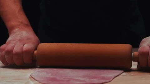 Beet Dough Kneading and a Rolling Pin in man's Hands Stock Footage 254941347
