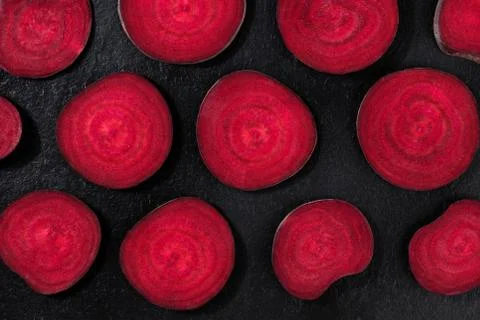 Beet flat lay pattern. Beetroot, shot from the top on a black background, cut Stock Photos