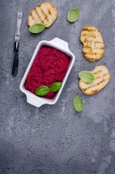 Beet pate in a ceramic dish Stock Photos