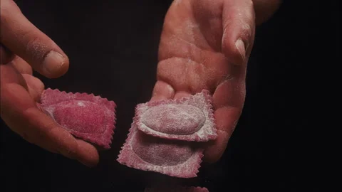 Beet ravioli put in a boiling pot Stock Footage 254850045