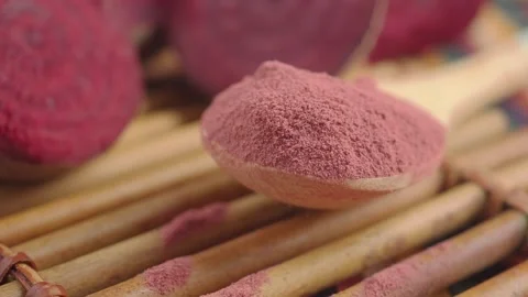 Beet root powder on wooden table Stock Footage 338155136