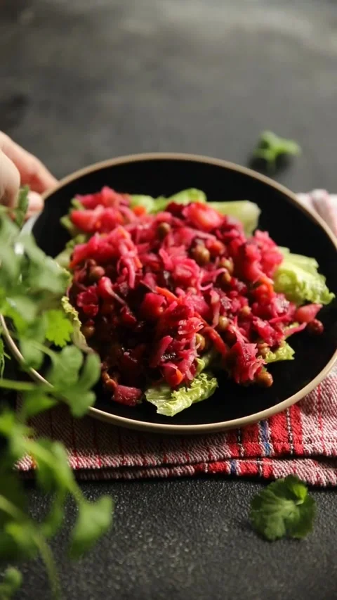 Beet salad baked beetroot, potatoes, green peas, green leaf salad tasty food Stock Footage 292307033