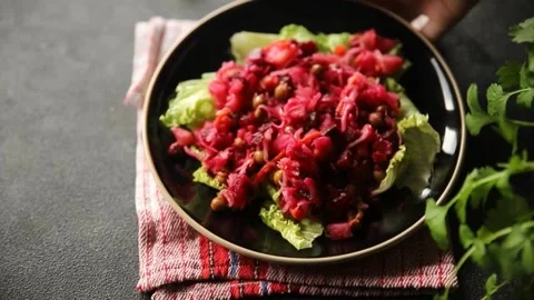 Beet salad Baked beetroot, potatoes, green peas, green leaf salad food dish Stock Footage 295063540