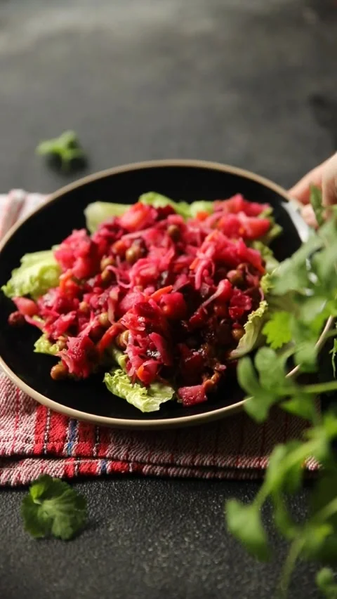 Beet salad Baked beetroot, potatoes, green peas, green leaf salad food dish Stock Footage 295063541