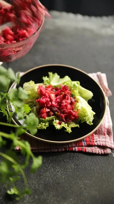 Beet salad Baked beetroot, potatoes, green peas, green leaf salad food dish Stock Footage 295063544