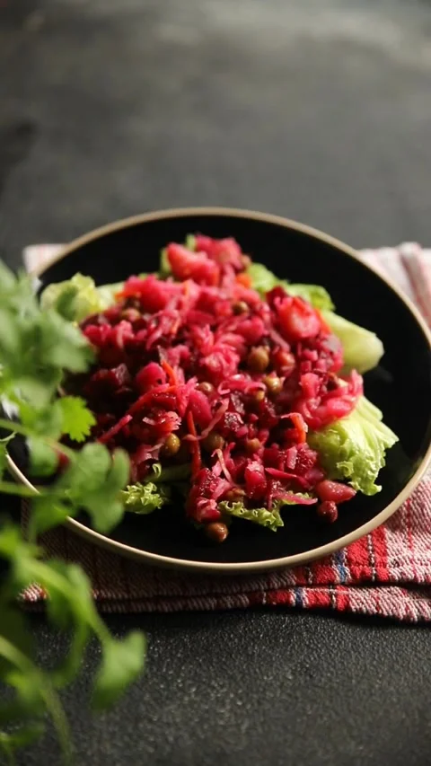 Beet salad Baked beetroot, potatoes, green peas, green leaf salad food dish Stock Footage 295063547