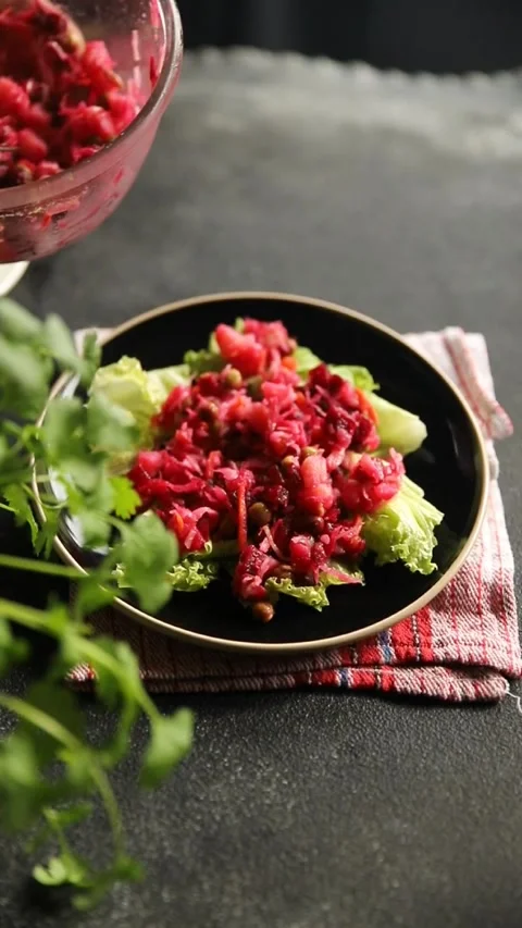 Beet salad Baked beetroot, potatoes, green peas, green leaf salad food dish Stock Footage 295063550