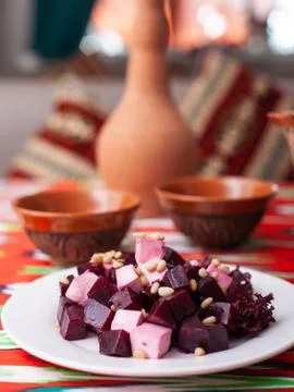 Beetroot and cheese salad with pine nuts dressed with butter. Asian style Stock Photos