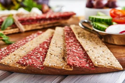 Beetroot and rye flour crackers with vegetables for making snacks on a wooden Stock Photos
