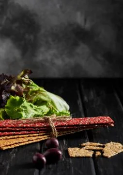 Beetroot and rye flour crackers with vegetables for making snacks on a black  Stock Photos