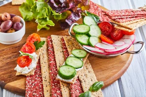 Beetroot and rye flour crackers with vegetables for making snacks on a wooden Stock Photos