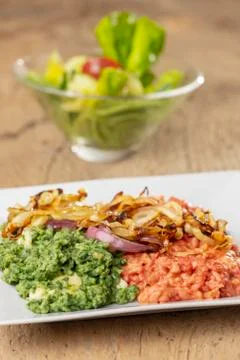 Beetroot and spinach spaetzle on a plate Stock Photos