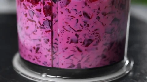 Beetroot are choped in a blender and mixed with cream in slow motion, food in Stock Footage 83177066
