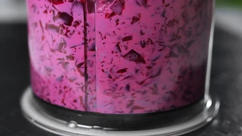 Beetroot are choped in a blender and mixed with cream Stock Footage 143590120