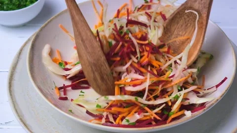 Beetroot, carrot, cabbage salad with oil and herbs, gray background. Stock Footage 149506835
