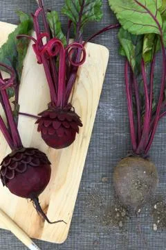Beetroot carving on wooden surface 스톡 사진
