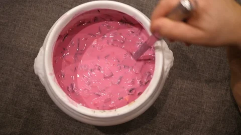 Beetroot cold Soup stirring in Bowl with Spoon. Ready to eat. Isolated close-up. Stock Footage 124873136
