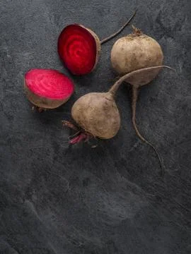 Beetroot cut in half on dark table. Overhead shot. Foto stock