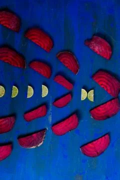 Beetroot in the form of a pattern with lemon slices on a vintage background Stock Photos