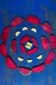 Beetroot in the form of a pattern with lemon slices on a vintage background Stock Photos